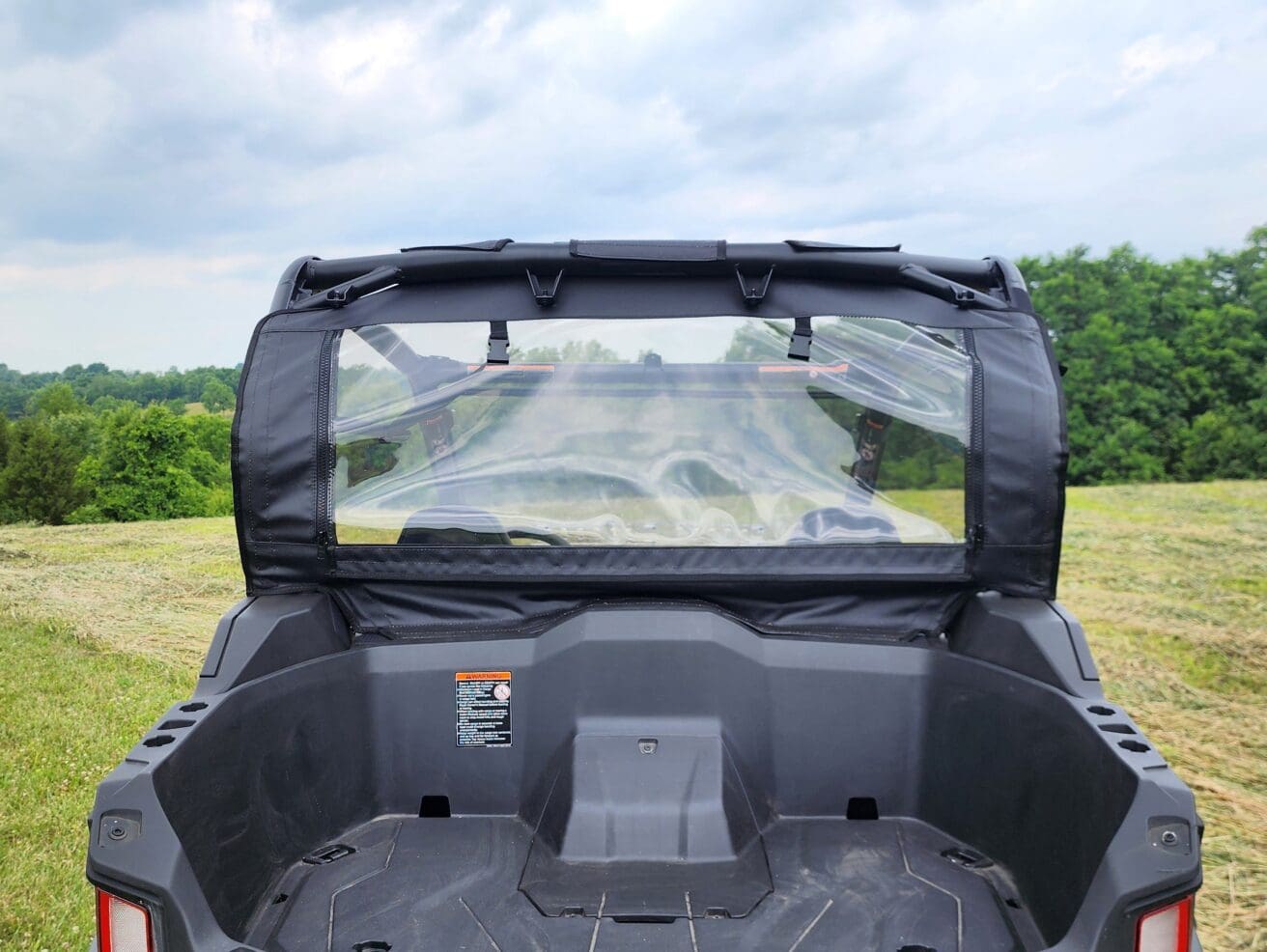 A back view of the rear windshield on a vehicle.