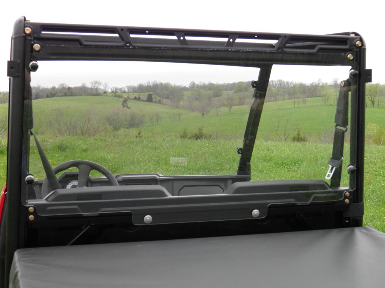 A view of the back window from inside an atv.