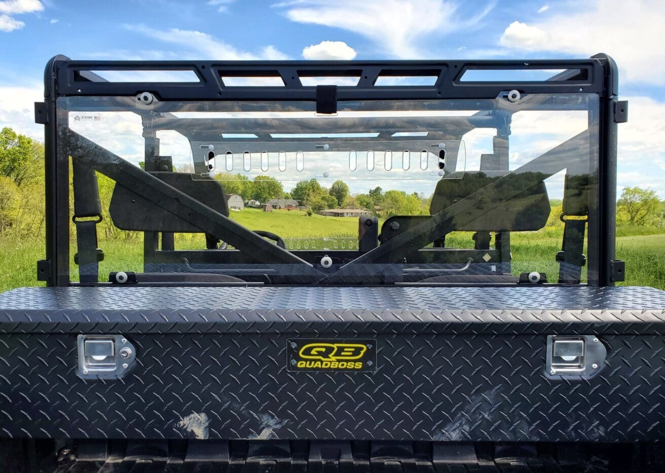 A view of the back of a truck with two seats.