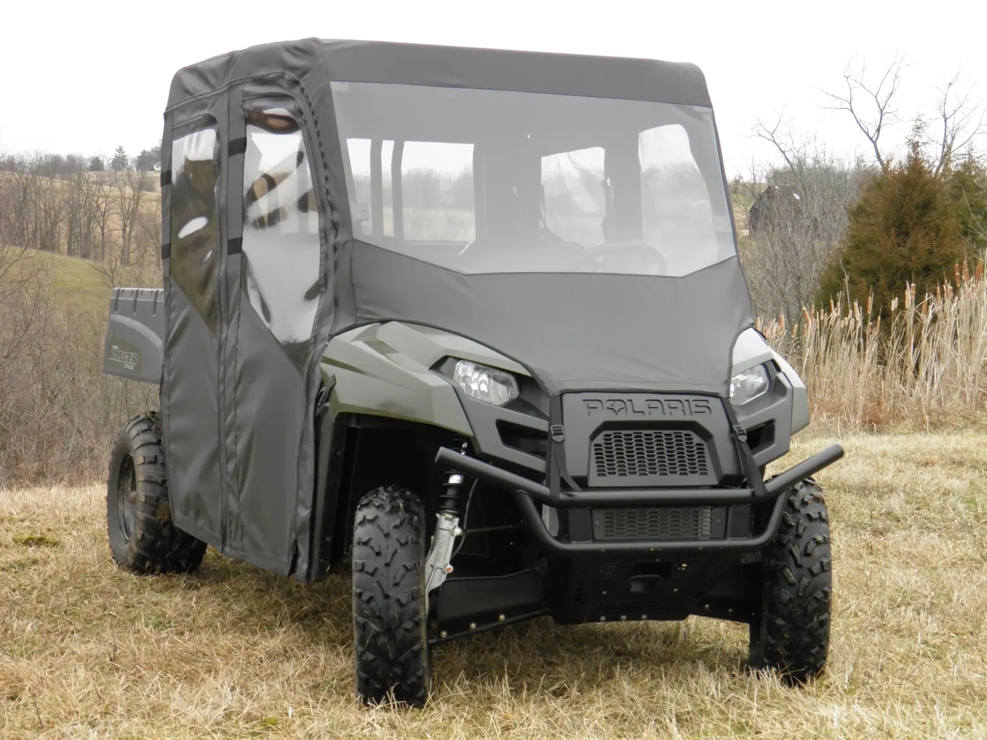 A utility vehicle with a cover on the back.