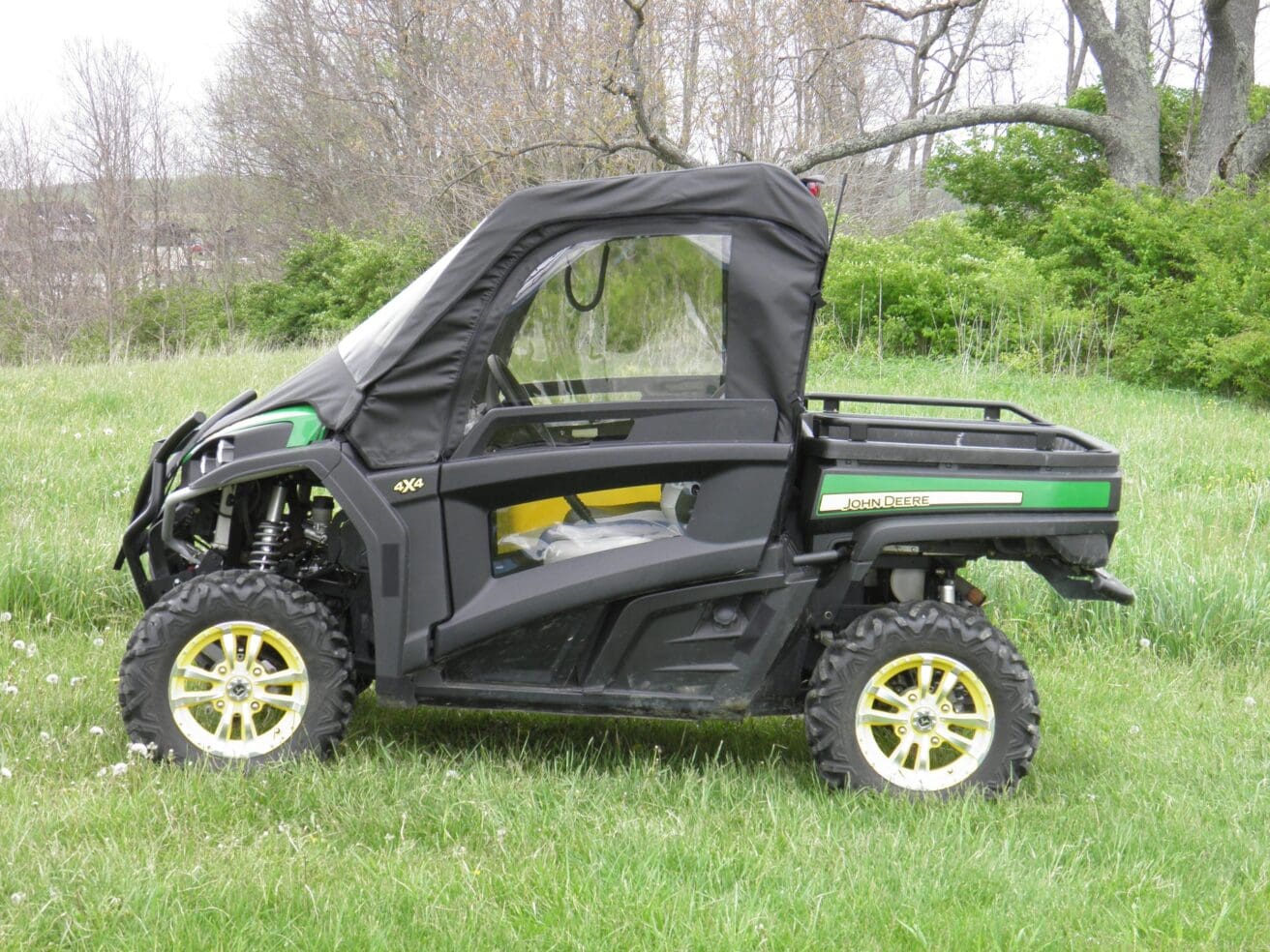 Off-road utility vehicle parked on grass.