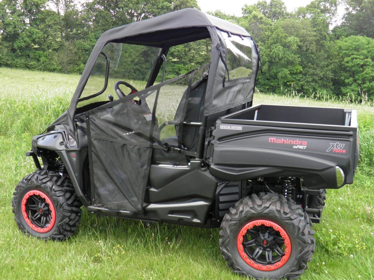 Black Mahindra mPACT XTV 780S side view.