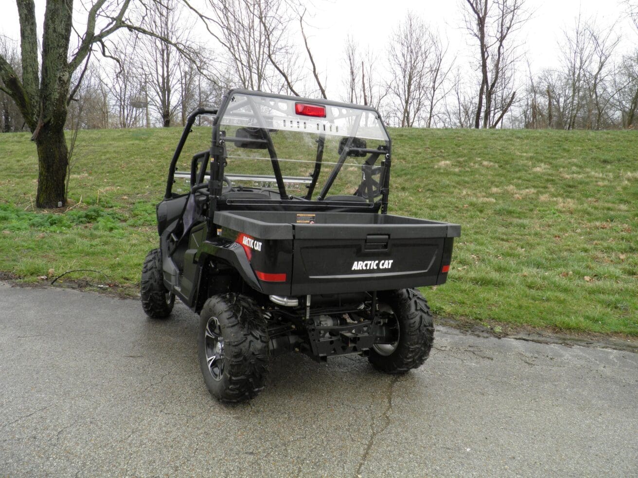 Off-road utility vehicle on paved road.