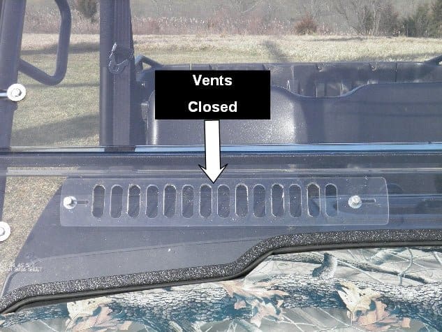 Vehicle windshield with closed vents indicator.