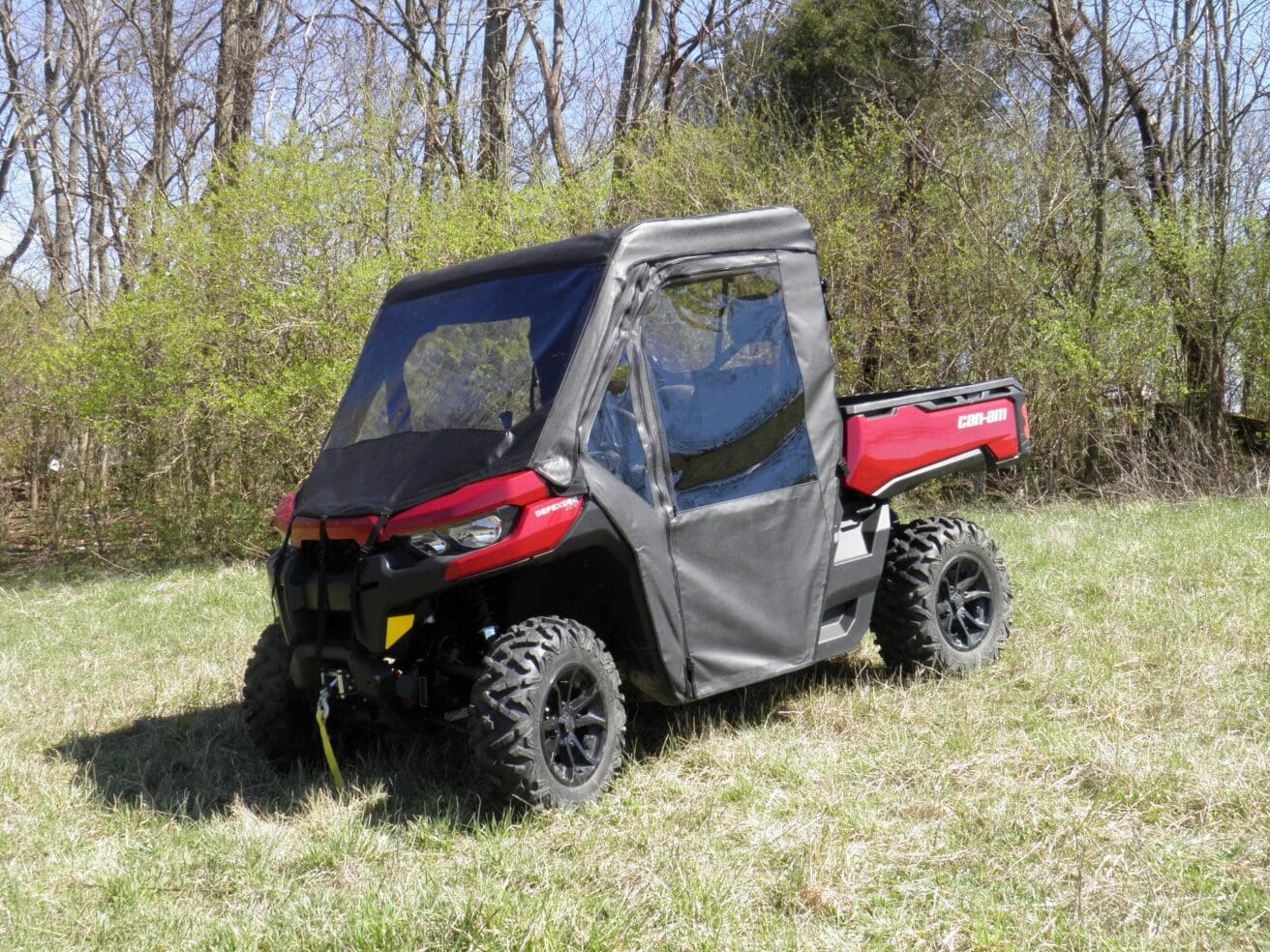 Red all-terrain vehicle with protective cover.
