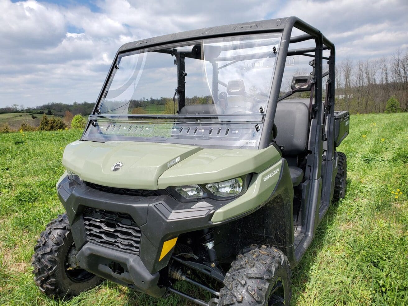 Utility vehicle on grassy field.