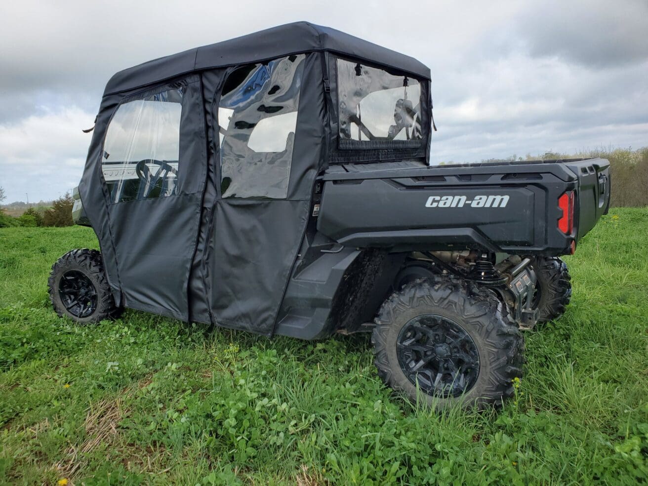 Off-road vehicle with black canopy cover.