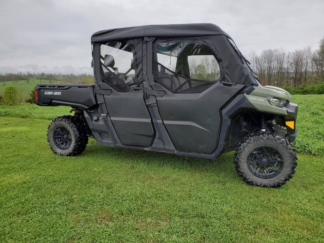 Off-road utility vehicle on grassy field.