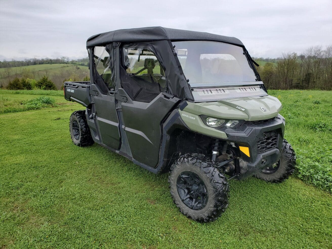 Off-road vehicle parked on grassy field.