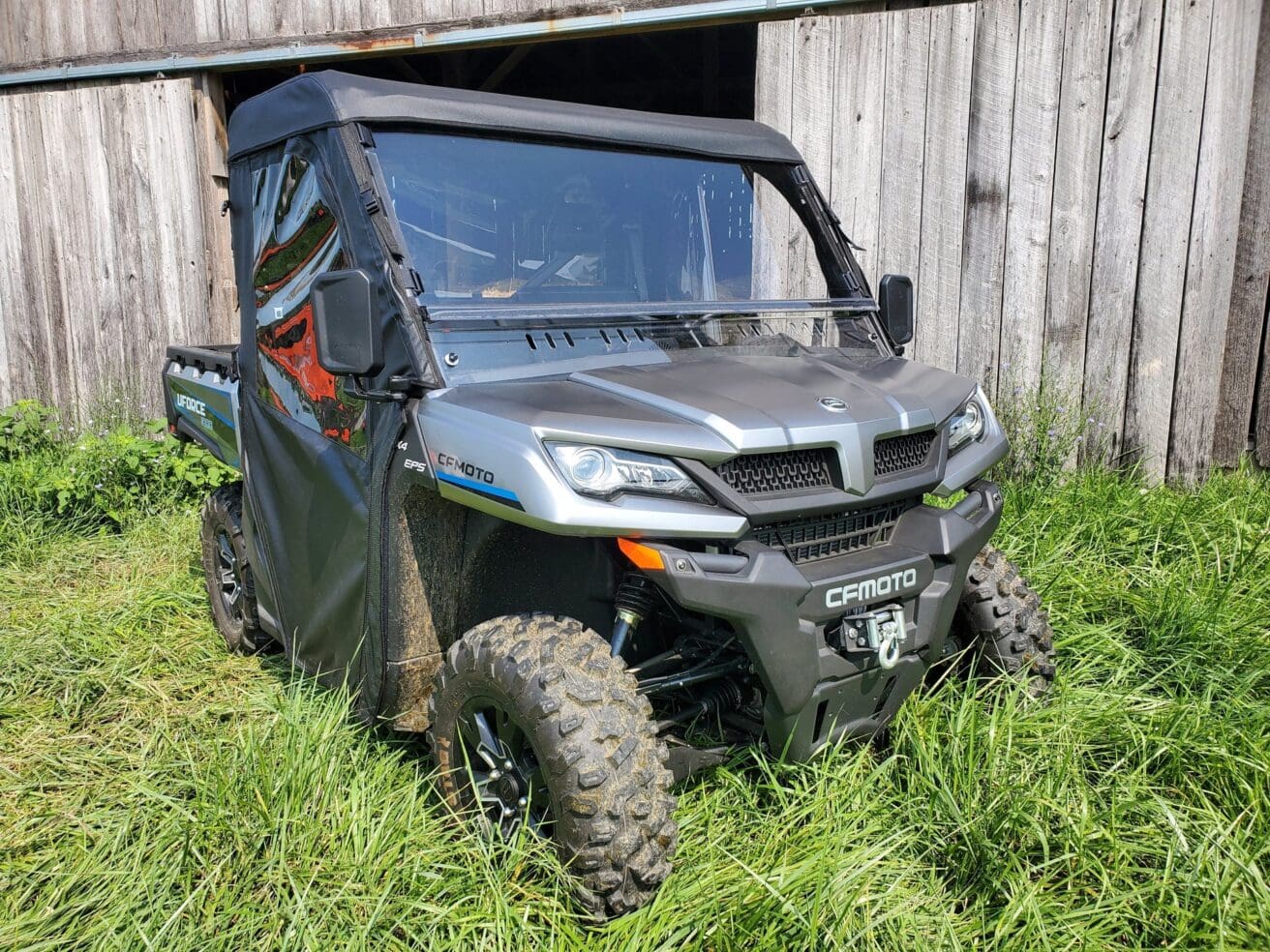 Off-road vehicle parked on grassy field.