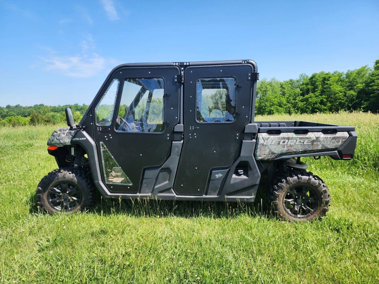 Off-road vehicle on grassy field.