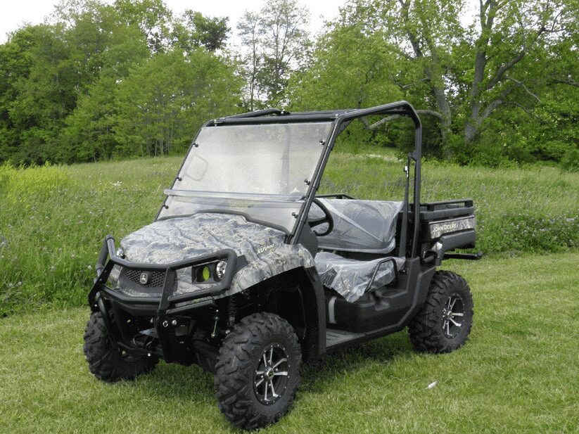 Off-road vehicle parked on grassy field.