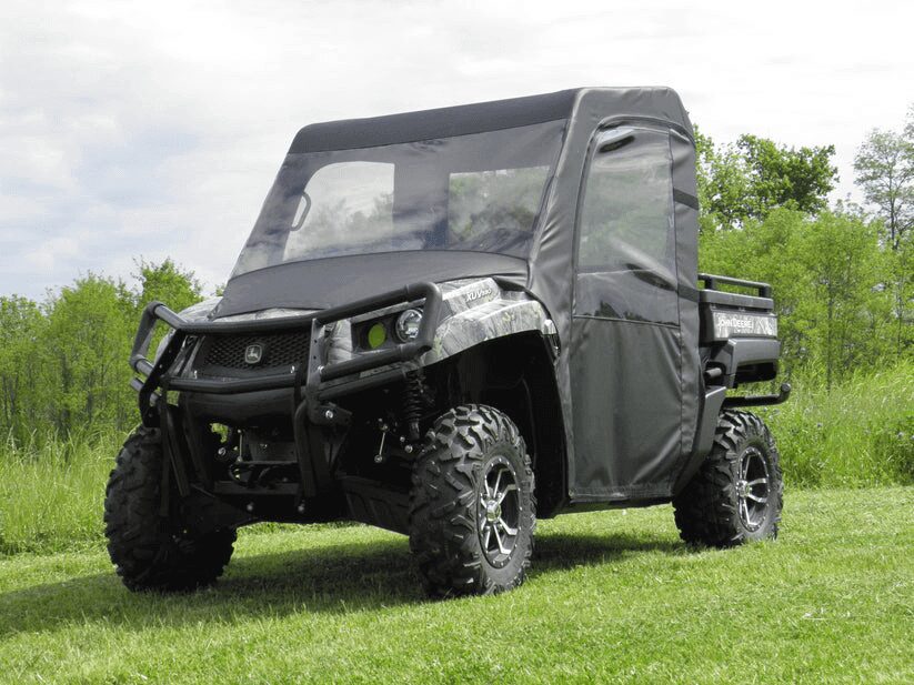 Off-road vehicle parked on grassy field.