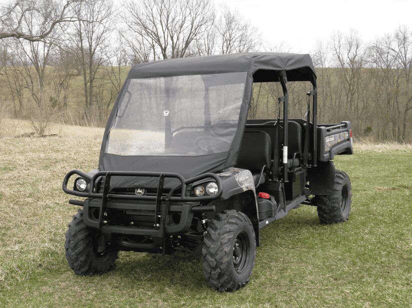 Off-road utility vehicle on grassy field.