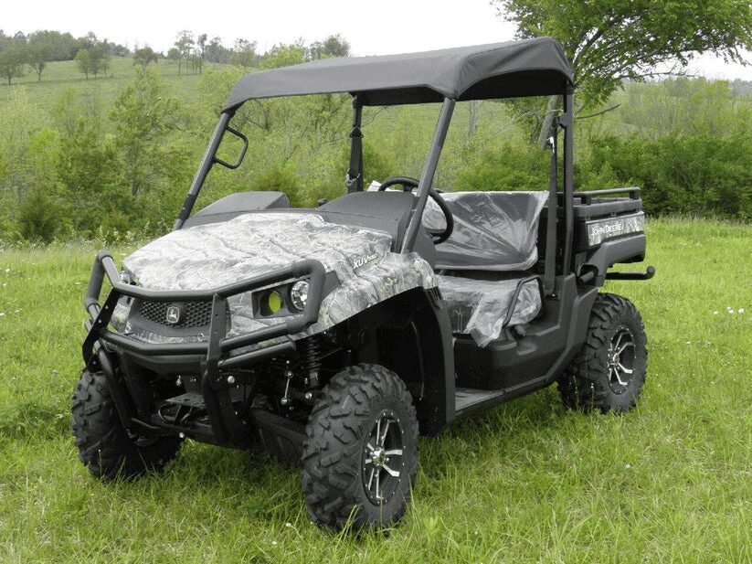 Off-road utility vehicle on grassy field.