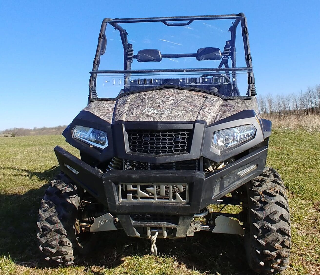 All-terrain vehicle on grassy field.