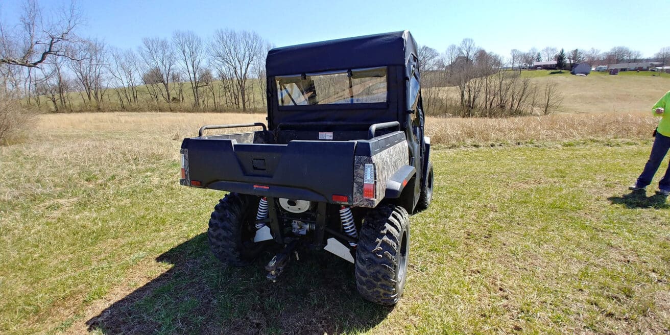 Utility vehicle on a grassy field.