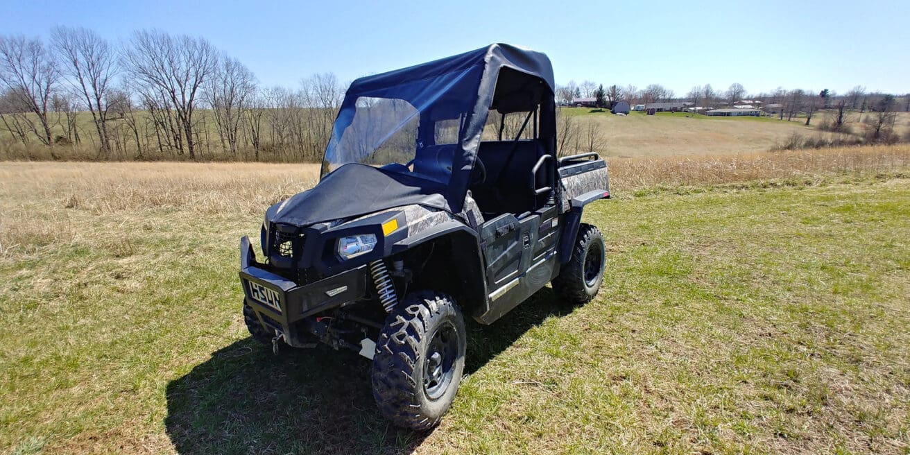 Off-road vehicle on grassy field.