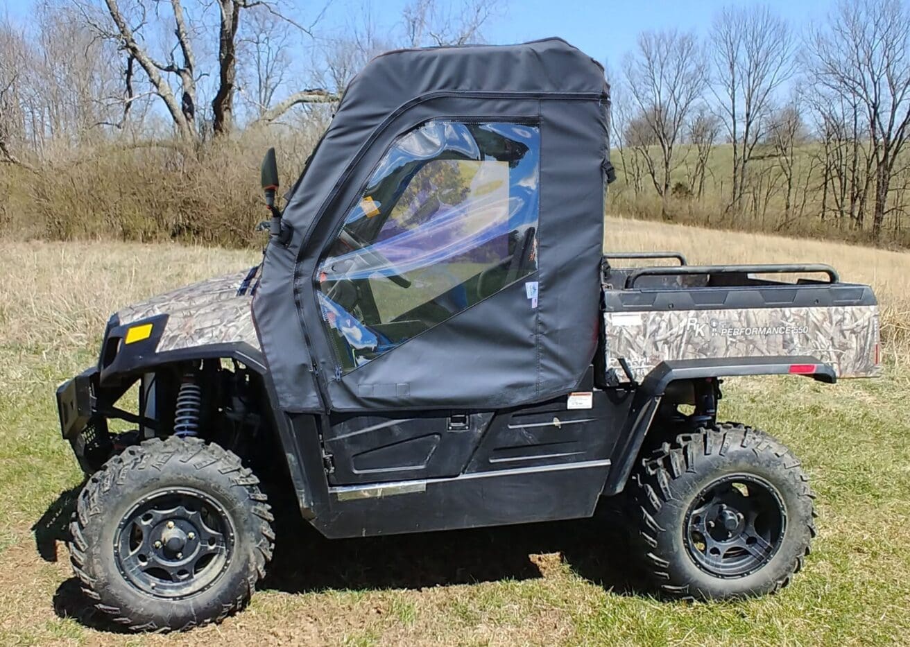 Off-road vehicle with black canvas cover.