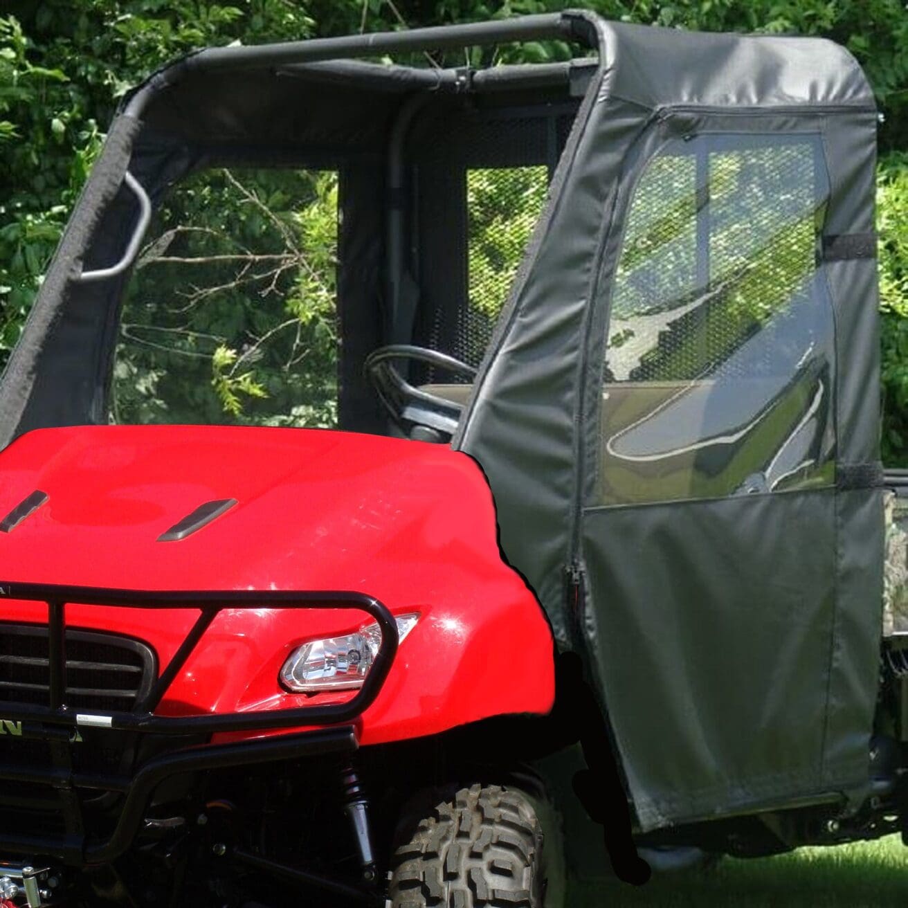 Red off-road vehicle with green canopy.