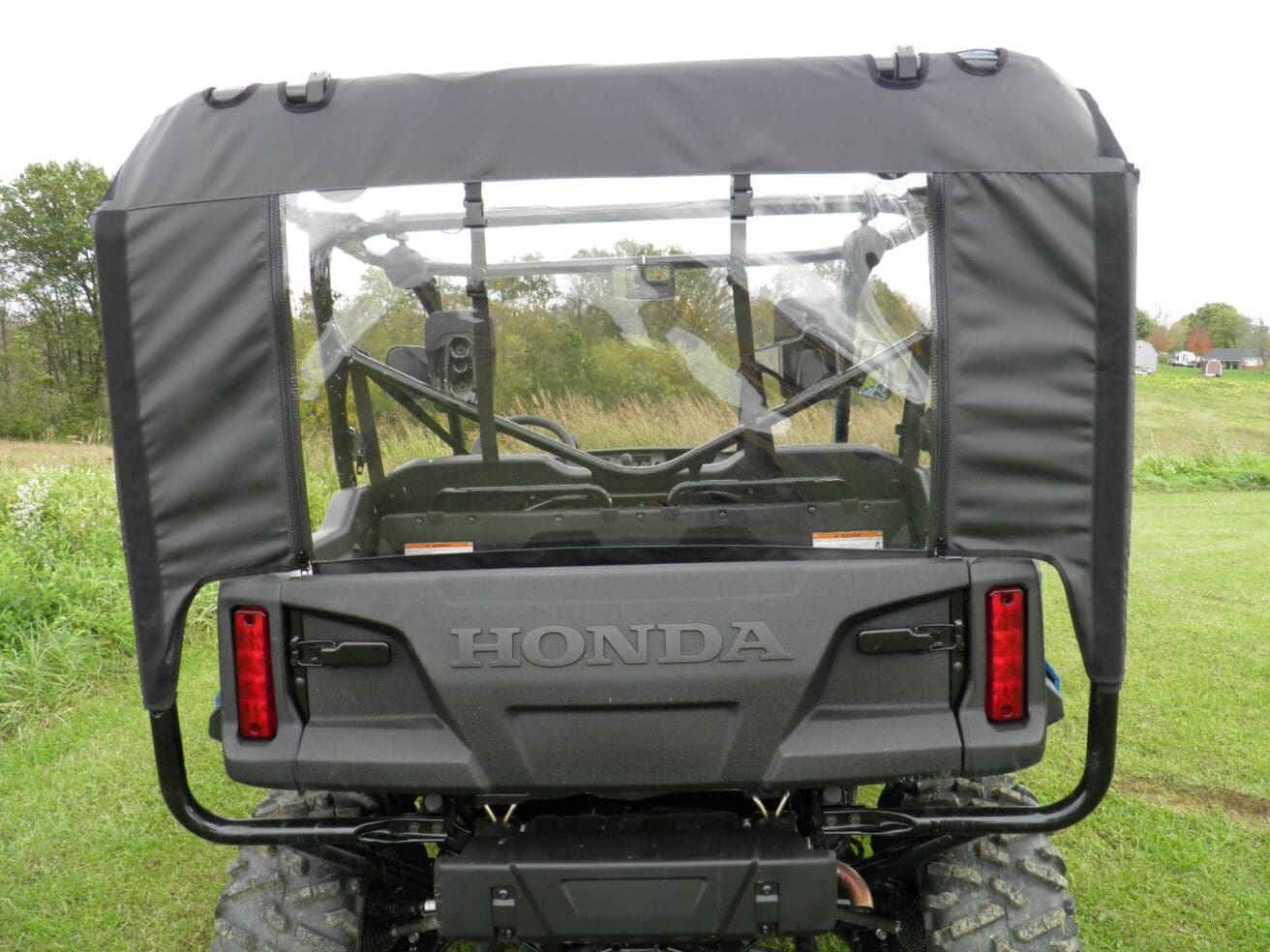 Honda off-road vehicle with rear cover.