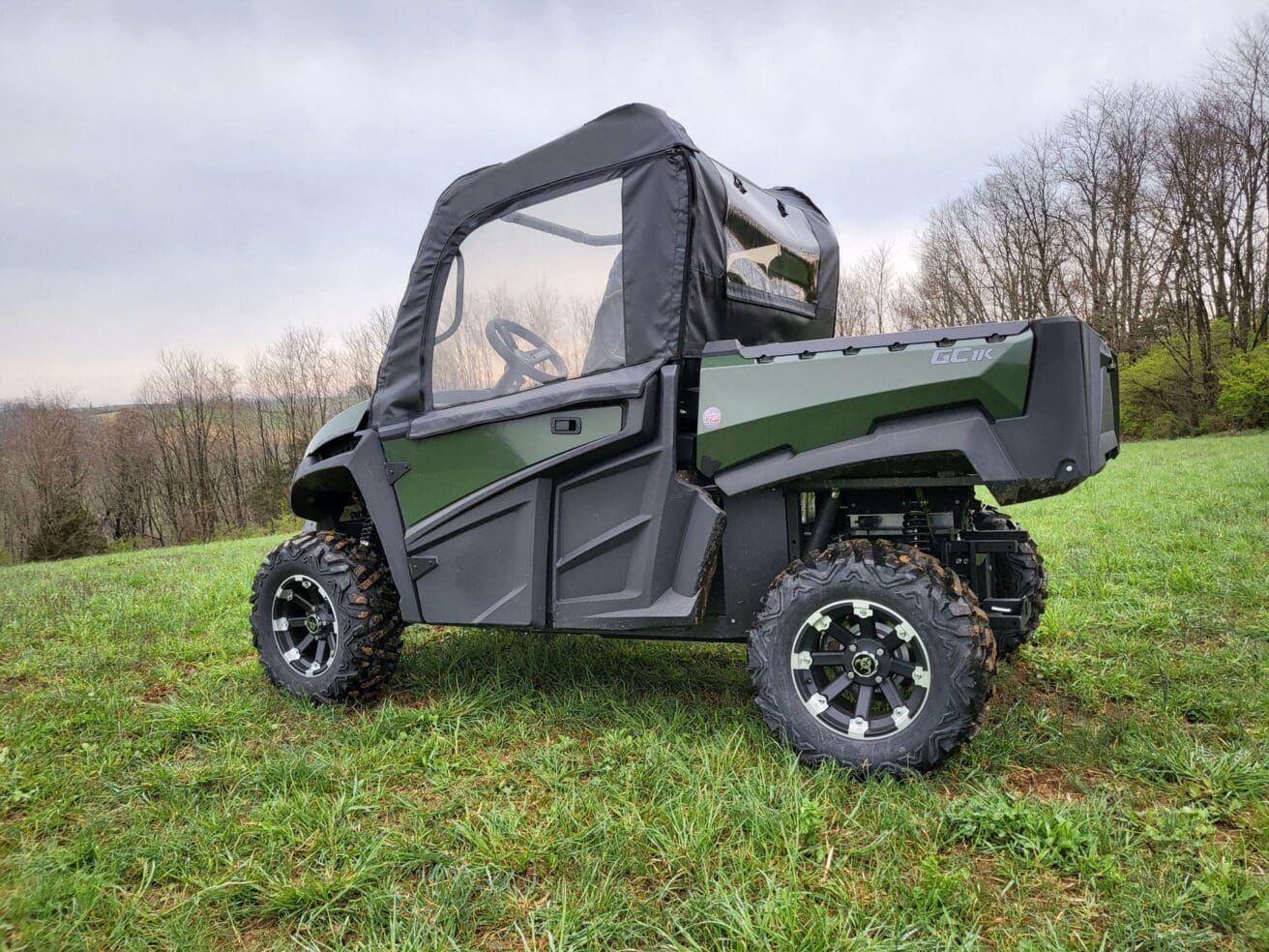 Off-road vehicle on grassy field.
