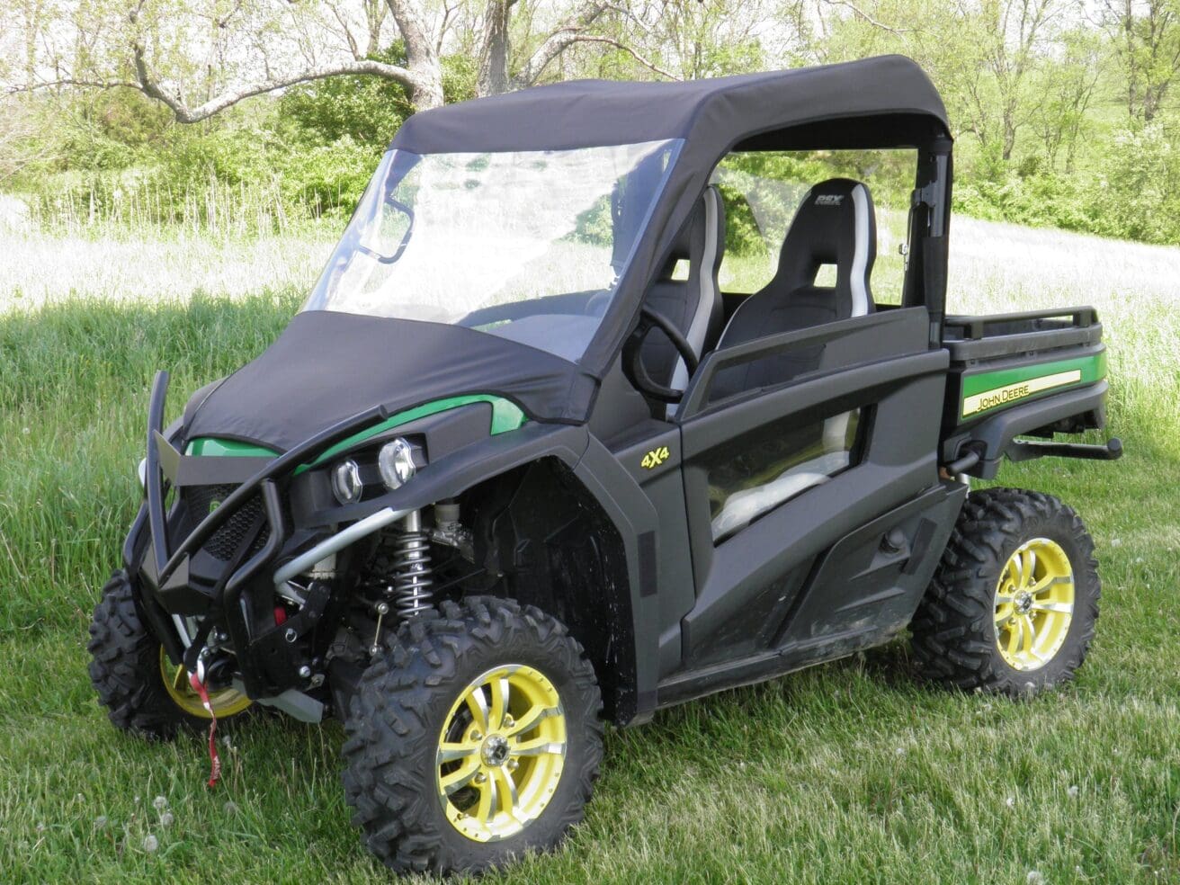 Off-road vehicle parked on grassy field.