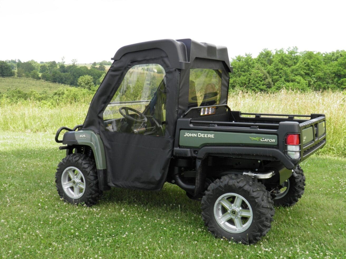 John Deere Gator 825 with cab enclosure.