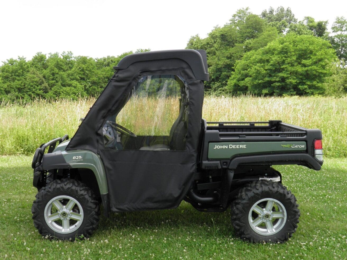 John Deere Gator 825i with cab enclosure.
