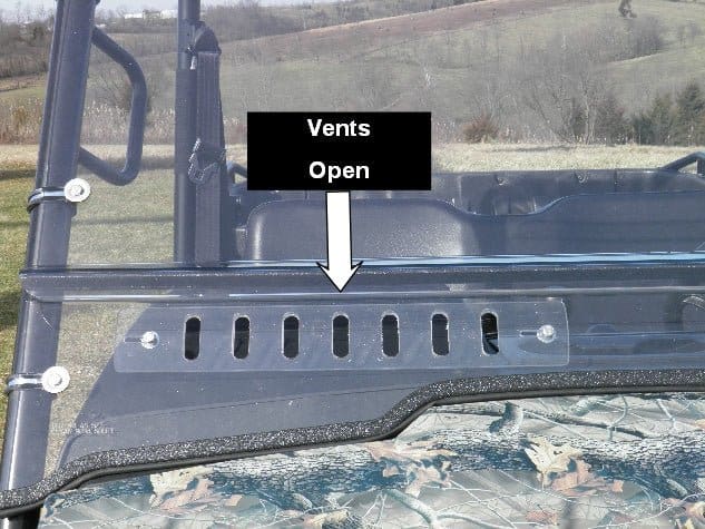 Vents open on outdoor vehicle windshield.
