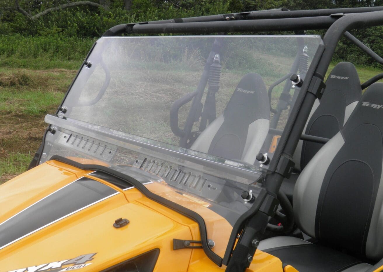 Clear windshield for yellow ATV.
