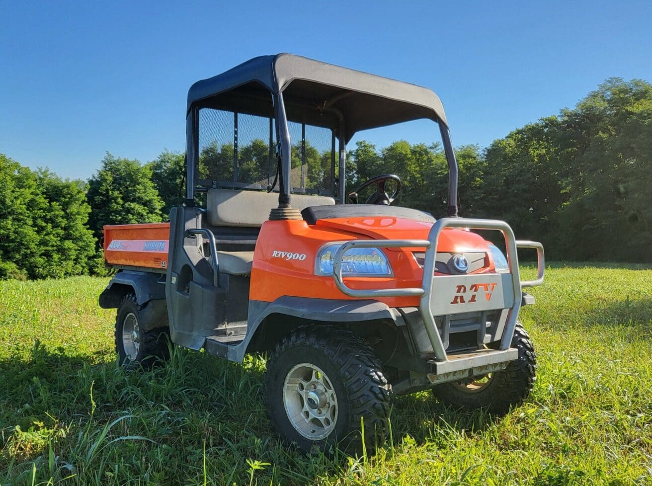 Orange Kubota RTV900 utility vehicle.