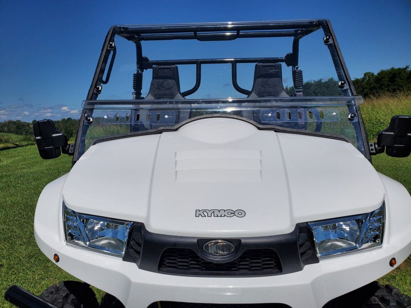 White Kymco UTV with windshield.
