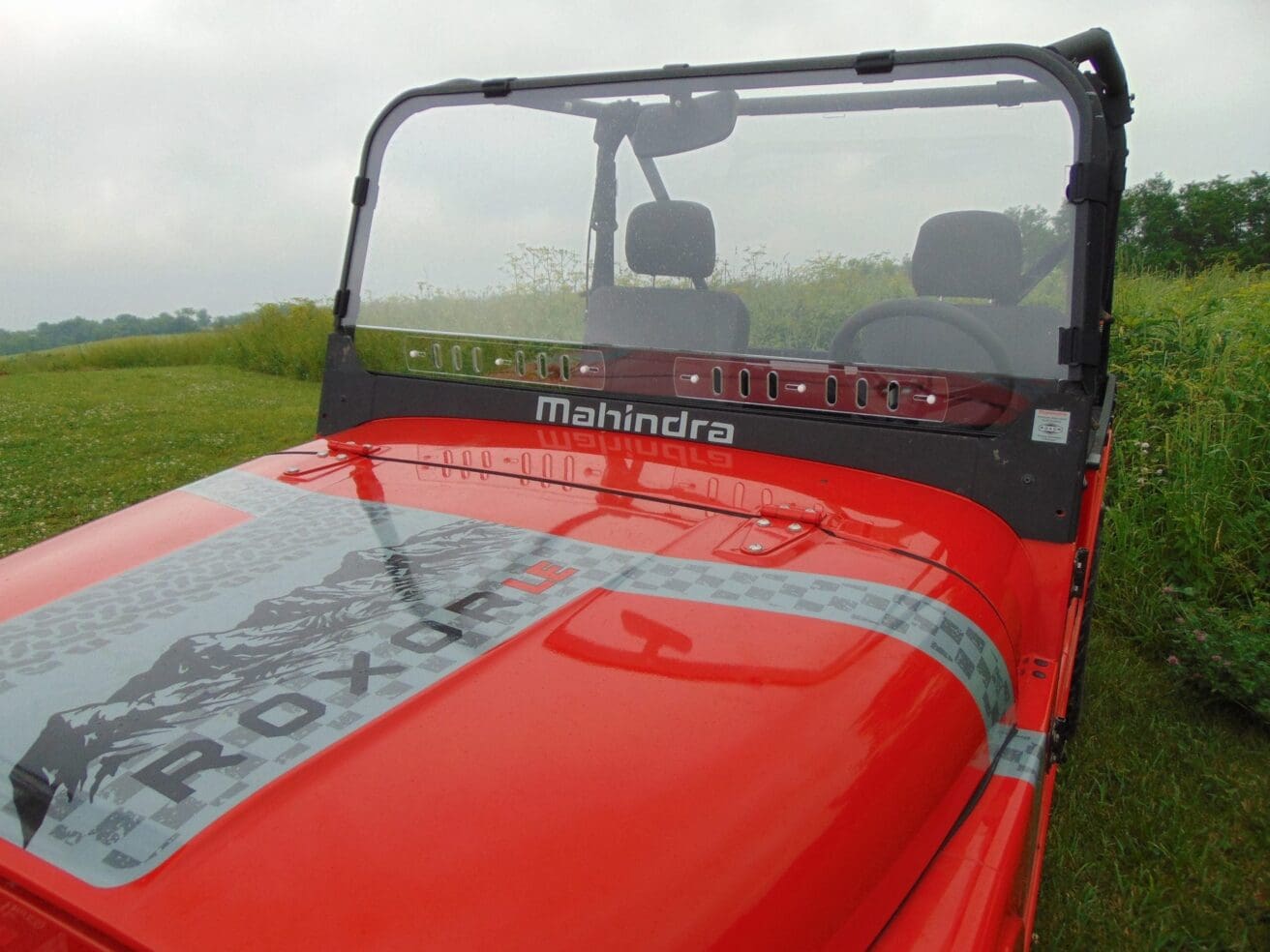 Red Mahindra Roxor with black trim.