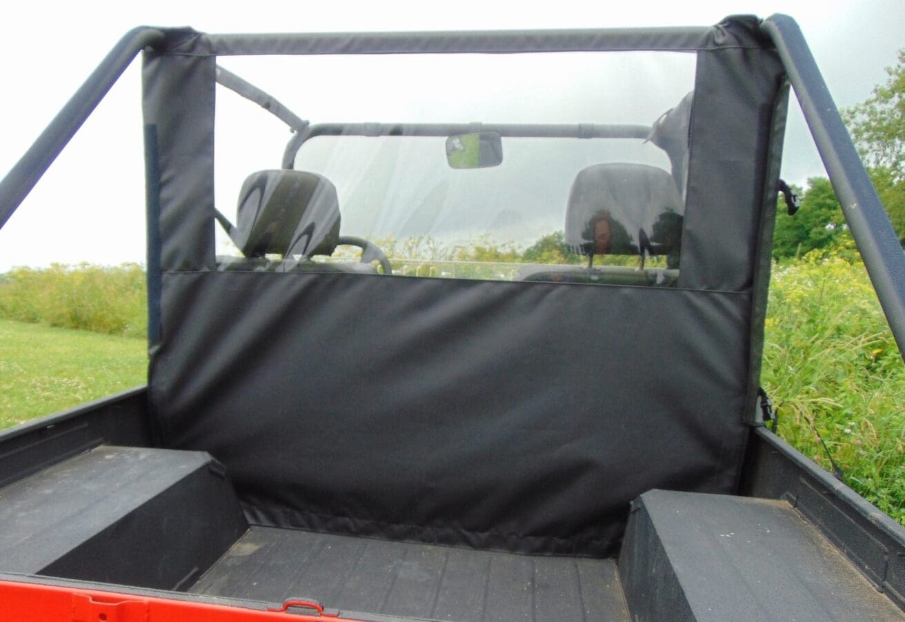 Black rear cab enclosure for a vehicle.