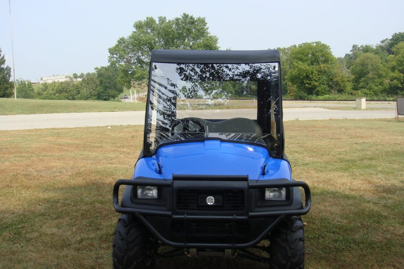 Blue utility vehicle with windshield.