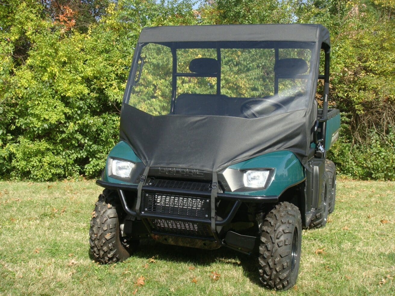 Green Polaris Ranger utility vehicle.