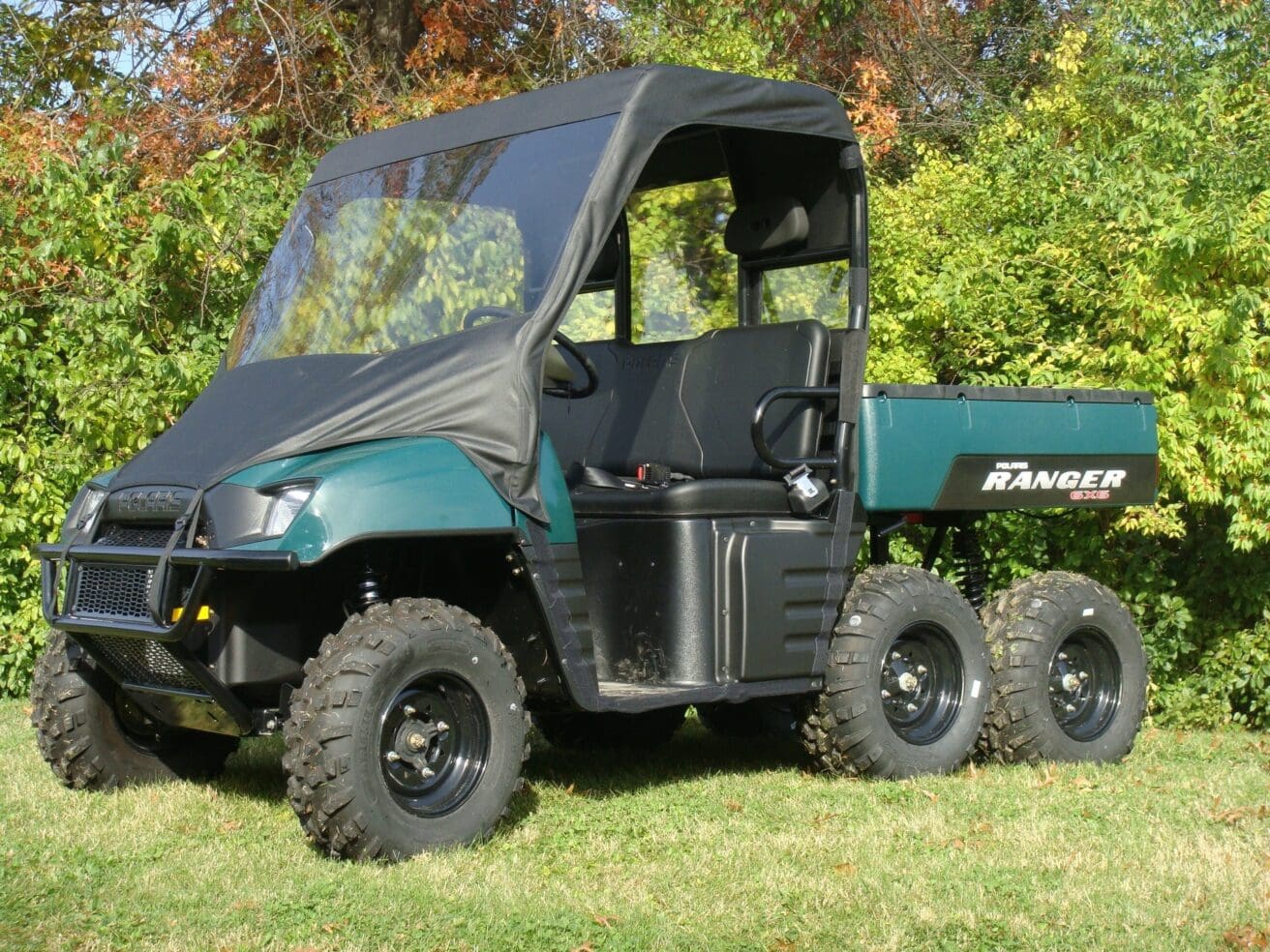 Green Polaris Ranger 6x6 utility vehicle.