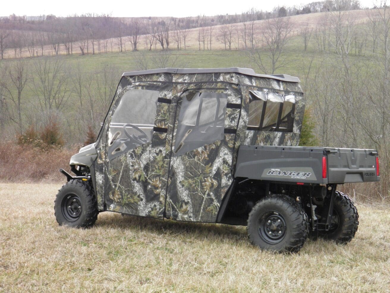 Camouflaged Polaris Ranger Crew in field.