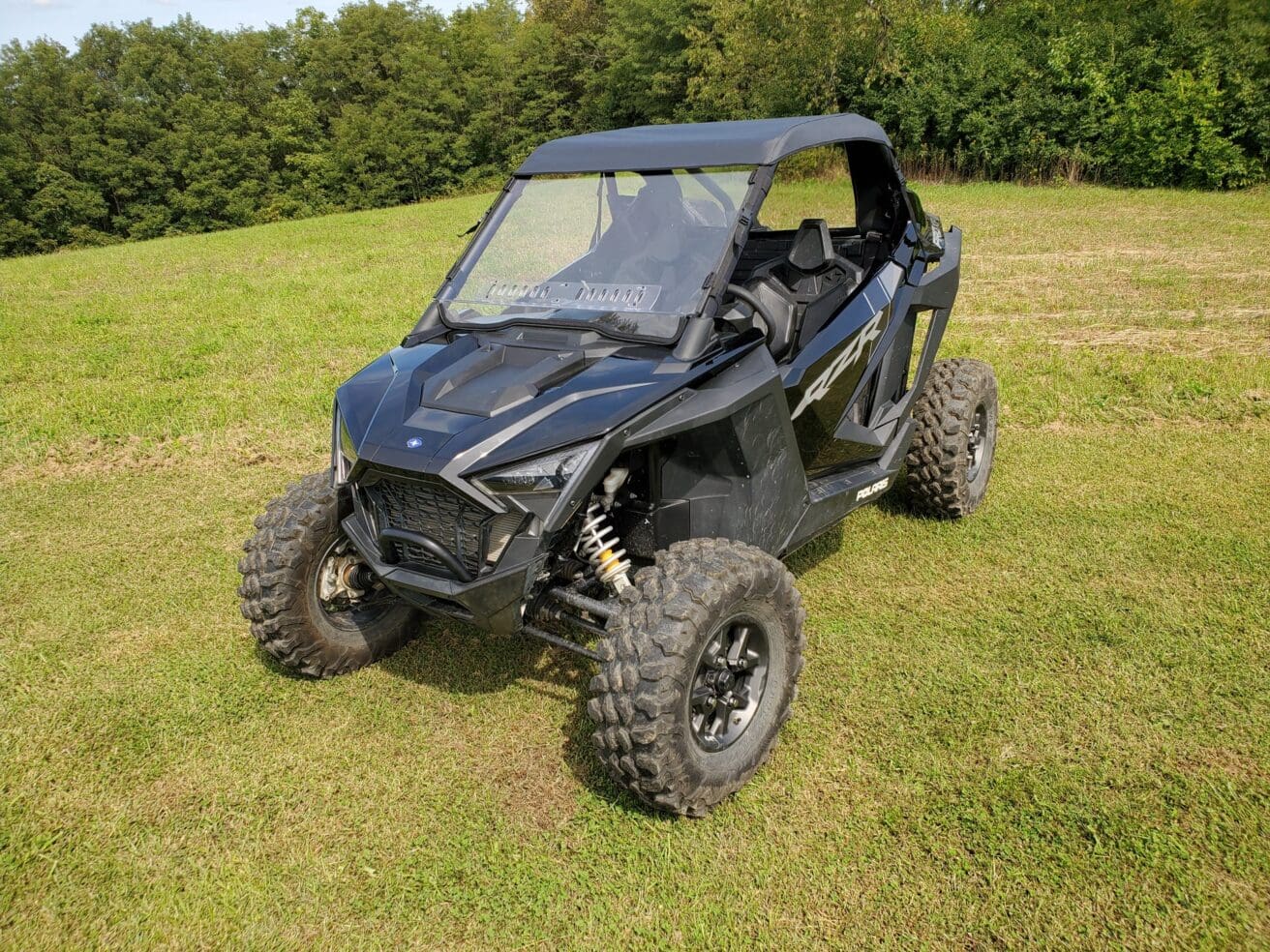 Black Polaris RZR off-road vehicle.