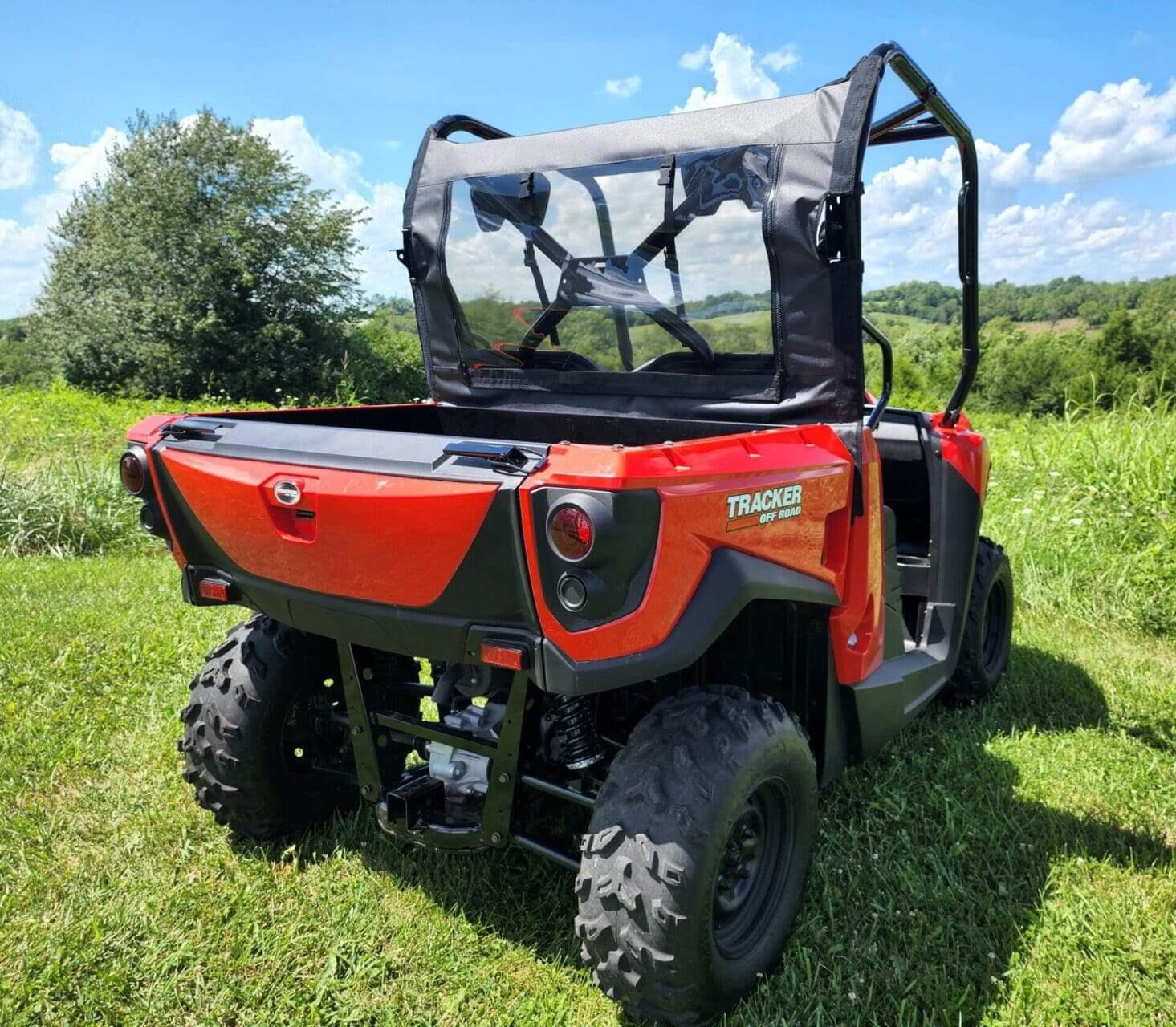 Red Tracker Off-Road vehicle, rear view.