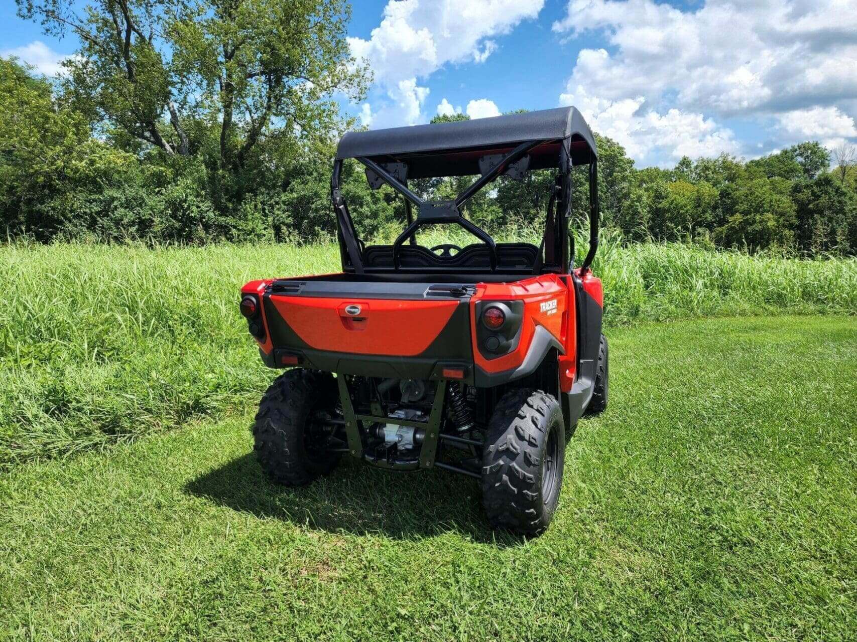 Red Tracker utility vehicle, rear view.