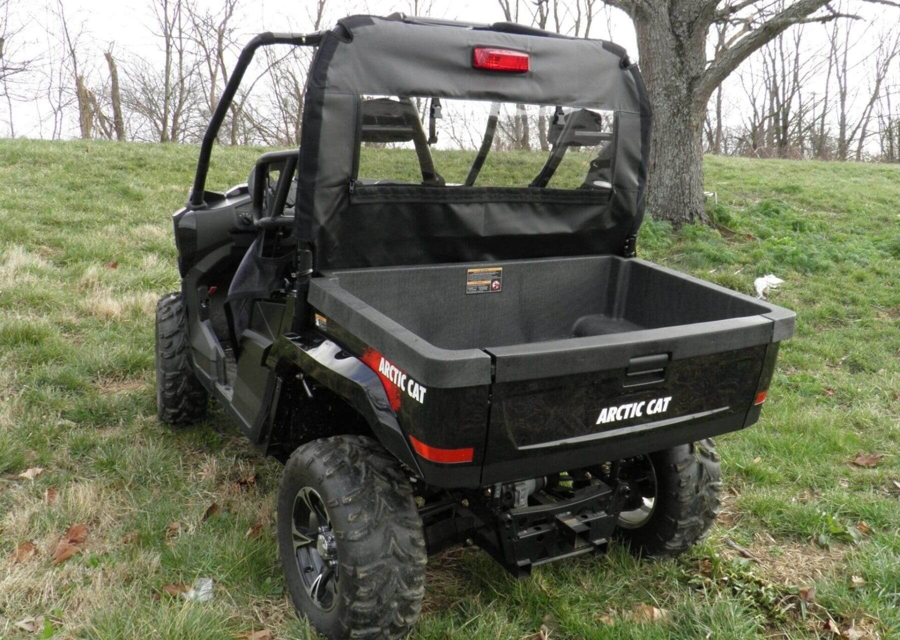 Black Arctic Cat utility vehicle, rear view.