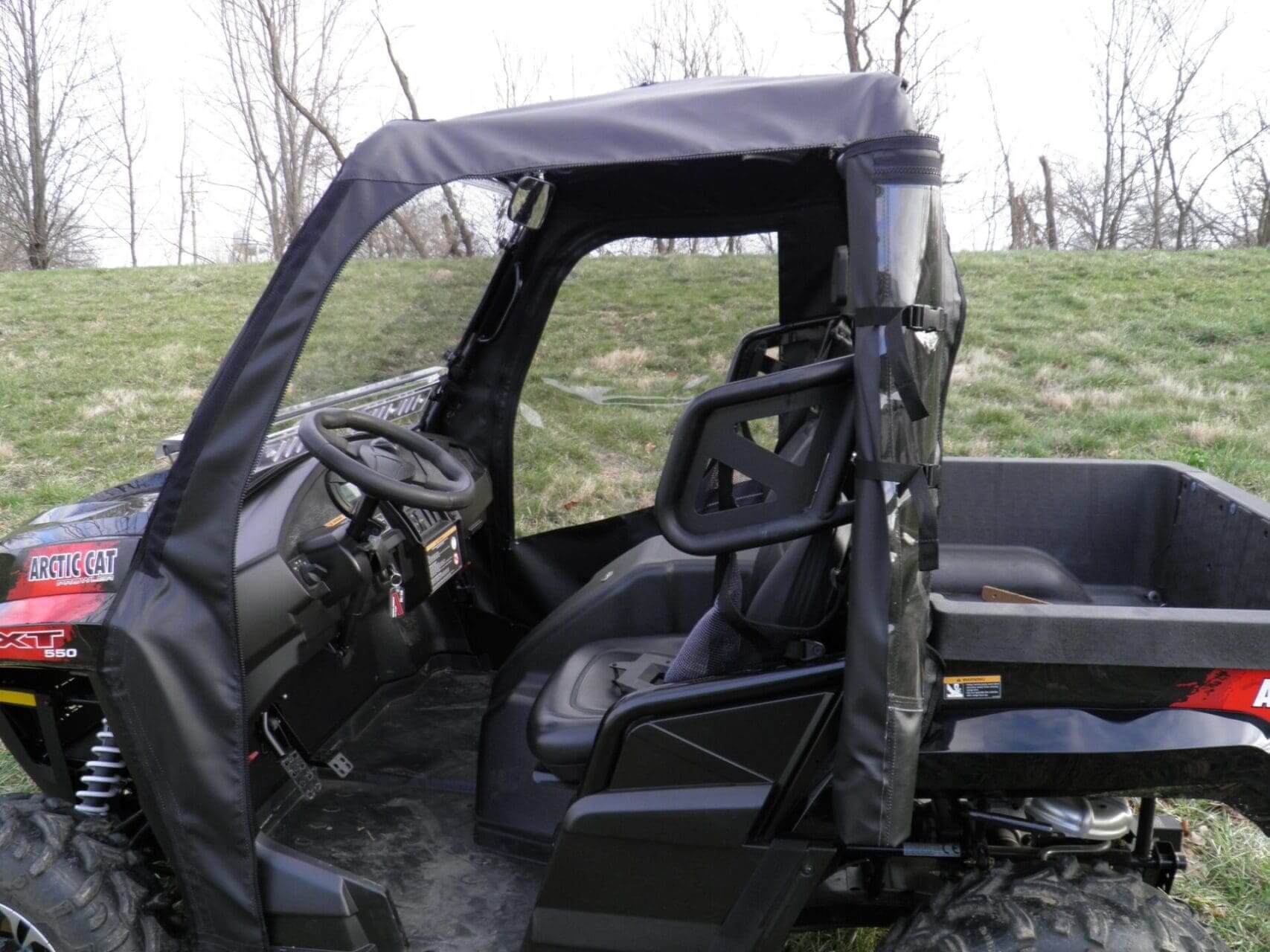 Black Arctic Cat ATV cab enclosure.