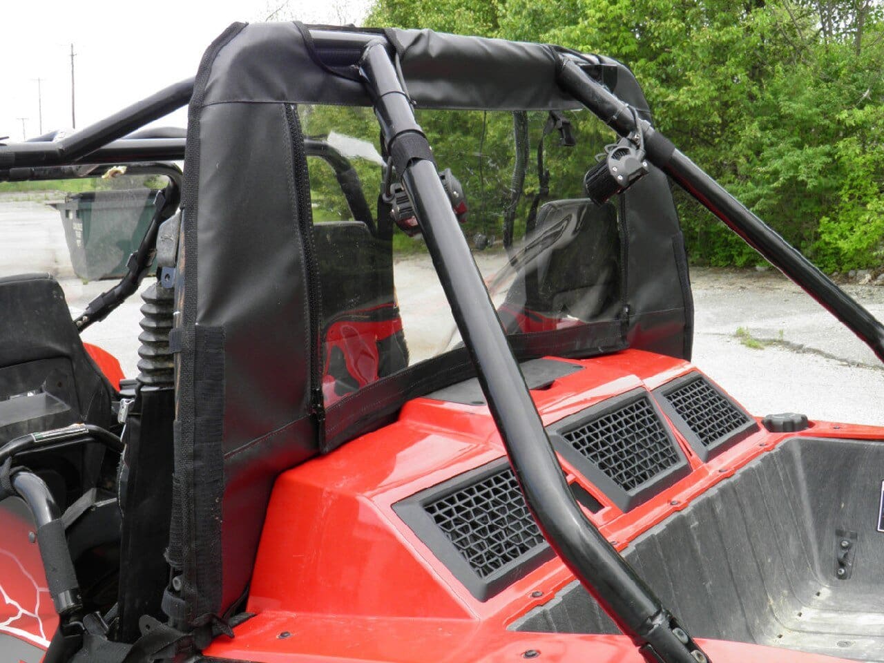 Red ATV with black vinyl rear window.