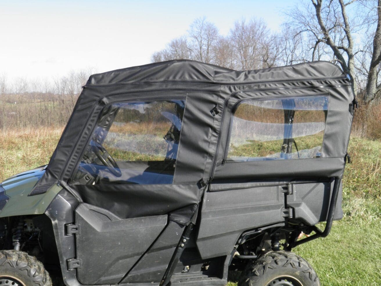 Black Honda Pioneer cab enclosure with windows.