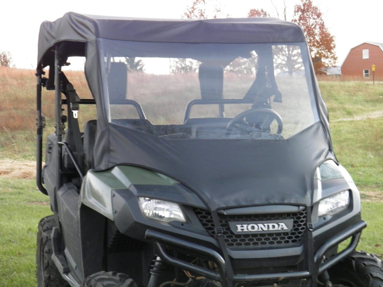 Honda Pioneer with windshield and top.