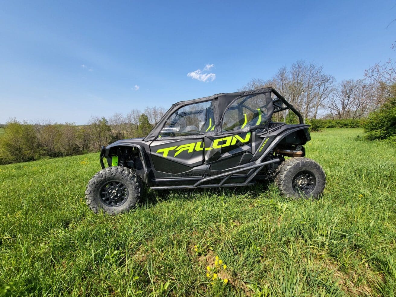Black Honda Talon 1000X in field.