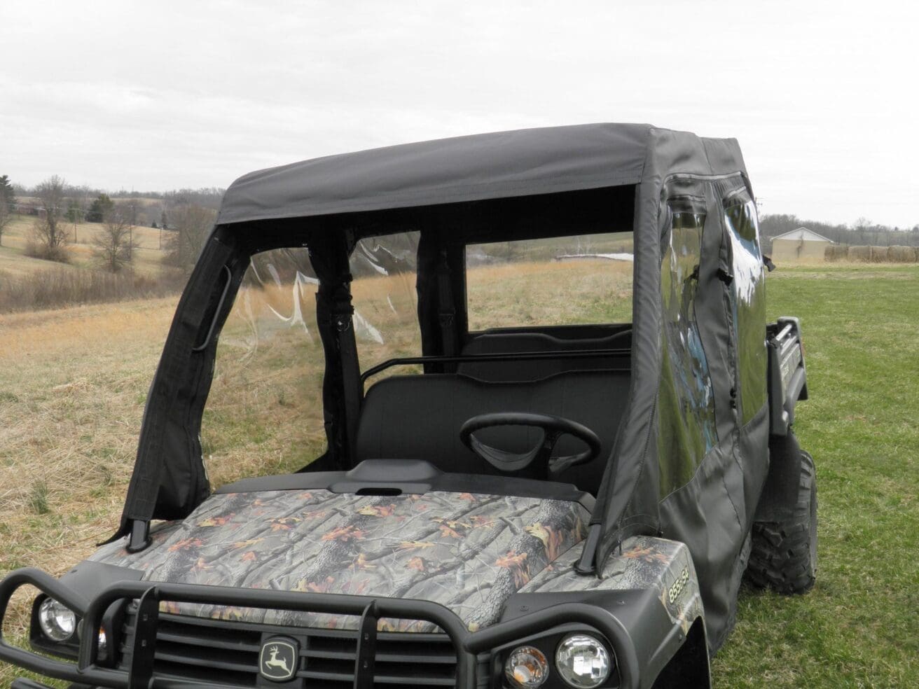 John Deere Gator with cab enclosure.