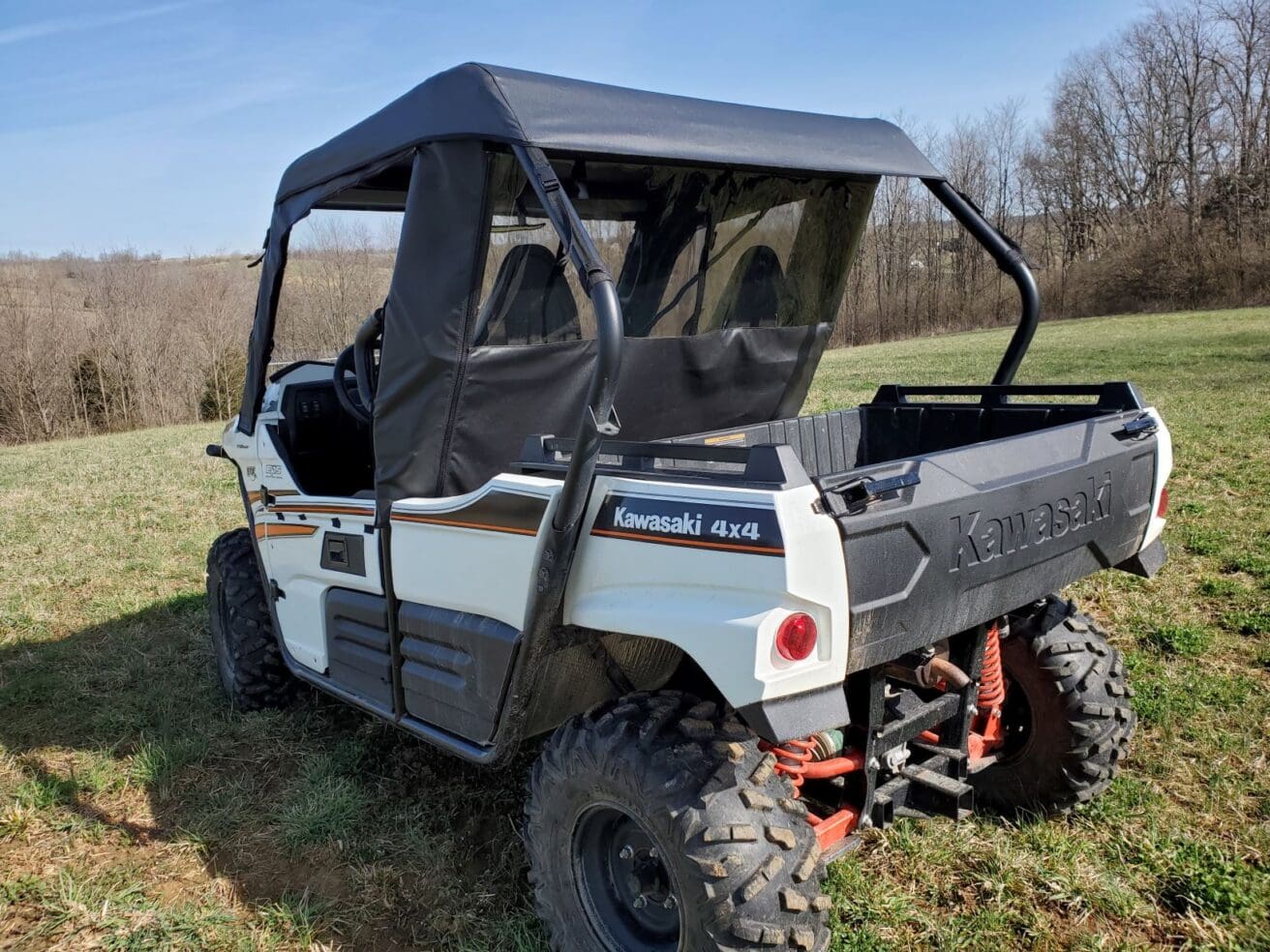 White Kawasaki Mule with cab enclosure.